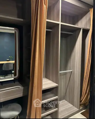 Spacious walk-in closet with modern shelving and elegant vanity area.