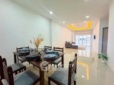 Spacious modern living room with dining area and stylish lighting
