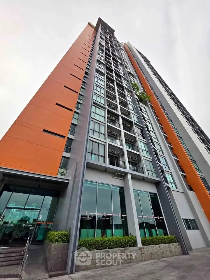 Modern high-rise building with sleek design and large windows, perfect for urban living.