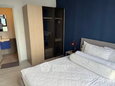 Modern bedroom with stylish wardrobe and cozy bed in a chic apartment