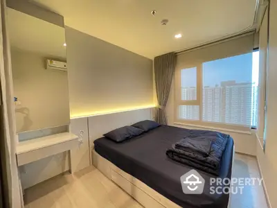 Modern bedroom with city view, featuring sleek design and natural light.