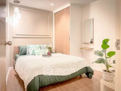 Cozy modern bedroom with stylish decor and natural light