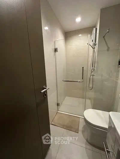 Modern bathroom with glass shower and sleek fixtures