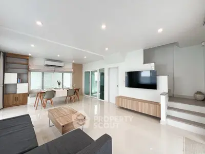 Spacious modern living room with sleek furniture and natural light