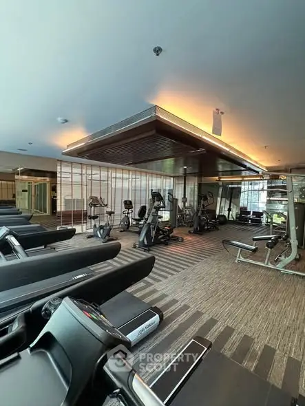 Modern gym with state-of-the-art fitness equipment and stylish design.