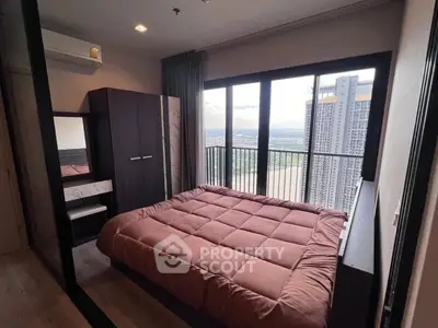Modern bedroom with stunning city view and cozy decor
