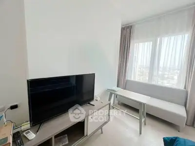 Modern living room with sleek TV setup and large window view