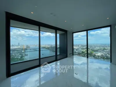 Luxurious high-rise apartment with stunning panoramic city and river views.