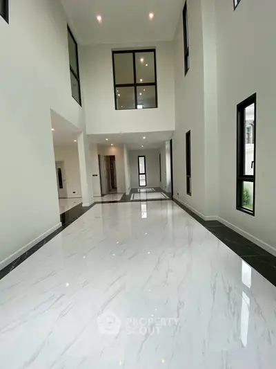 Spacious modern interior with high ceilings and elegant marble flooring