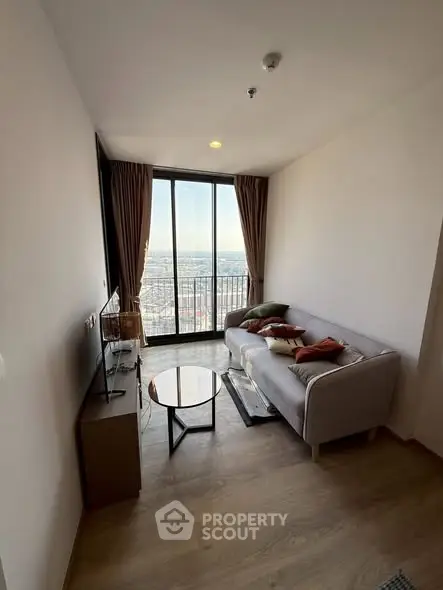 Cozy living room with stunning city view and modern furnishings