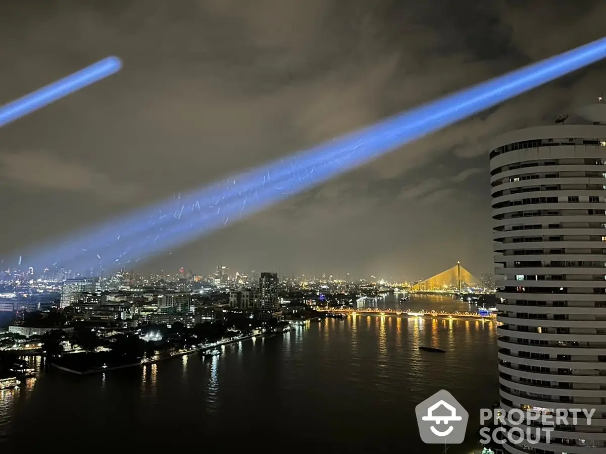 Stunning nighttime cityscape view with river and illuminated bridge