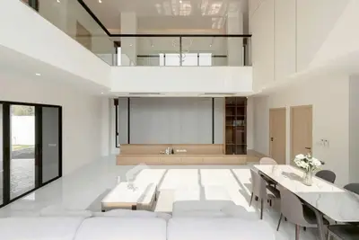 Spacious modern living room with high ceilings and elegant decor