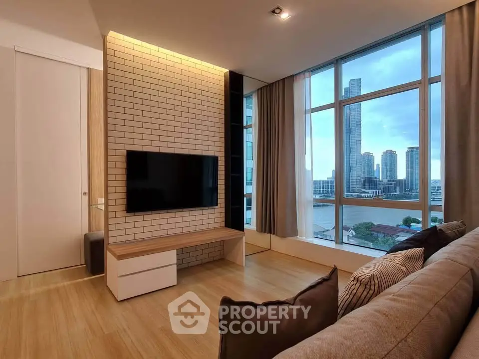Modern living room with stunning city view and stylish brick accent wall.