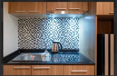 Modern kitchen with sleek cabinetry and stylish backsplash