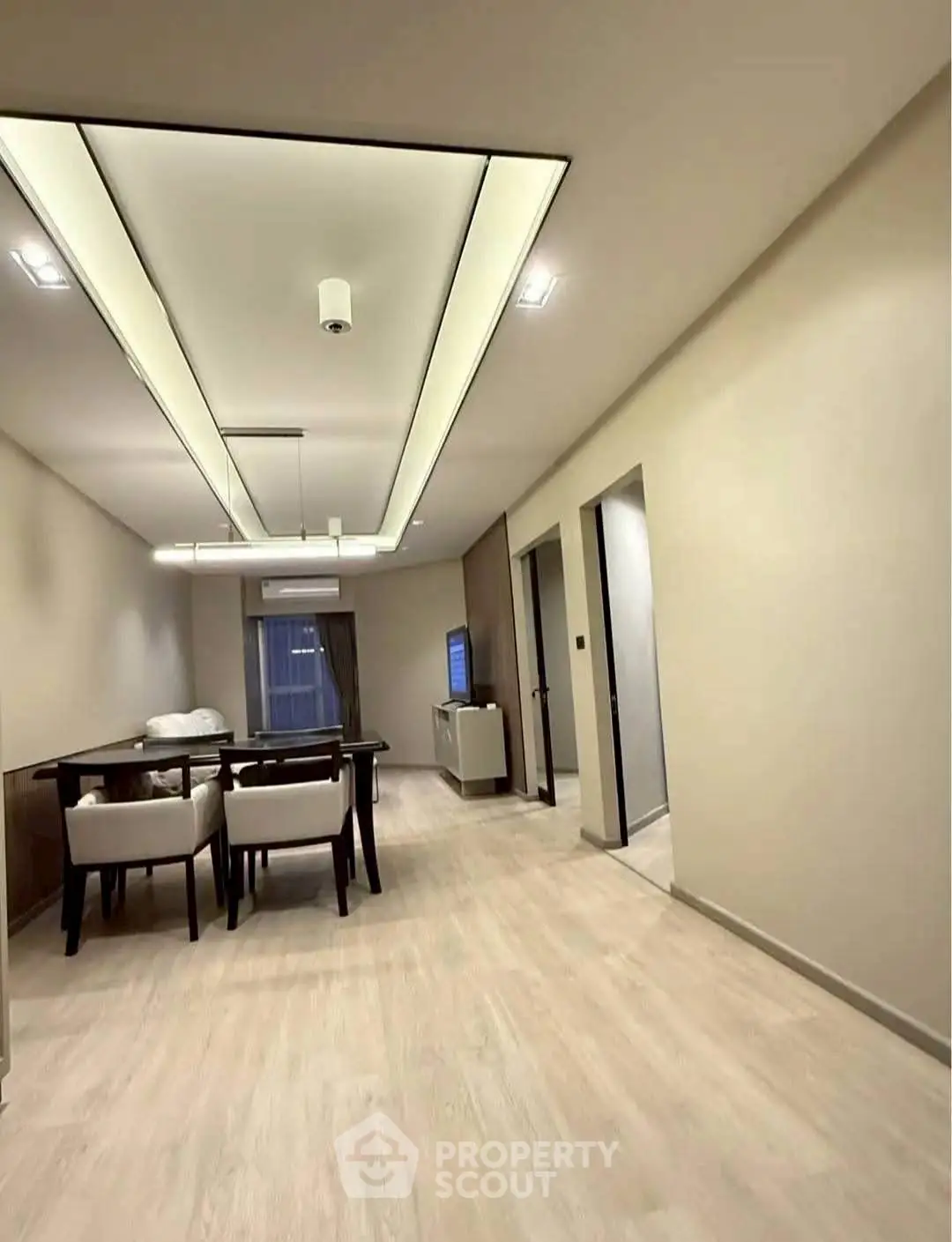 Modern dining area with sleek lighting and elegant decor