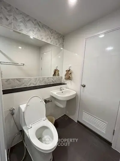 Modern bathroom with sleek fixtures and stylish tile accents