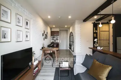 Modern living room with stylish decor and open layout, featuring a cozy seating area and elegant lighting.