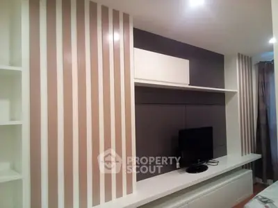 Modern living room with stylish TV unit and elegant wall design