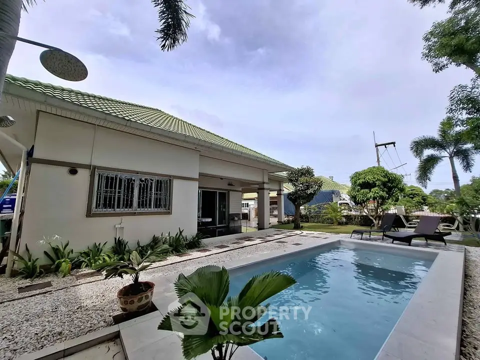 Charming house with lush garden and inviting pool, perfect for relaxation and outdoor entertainment.