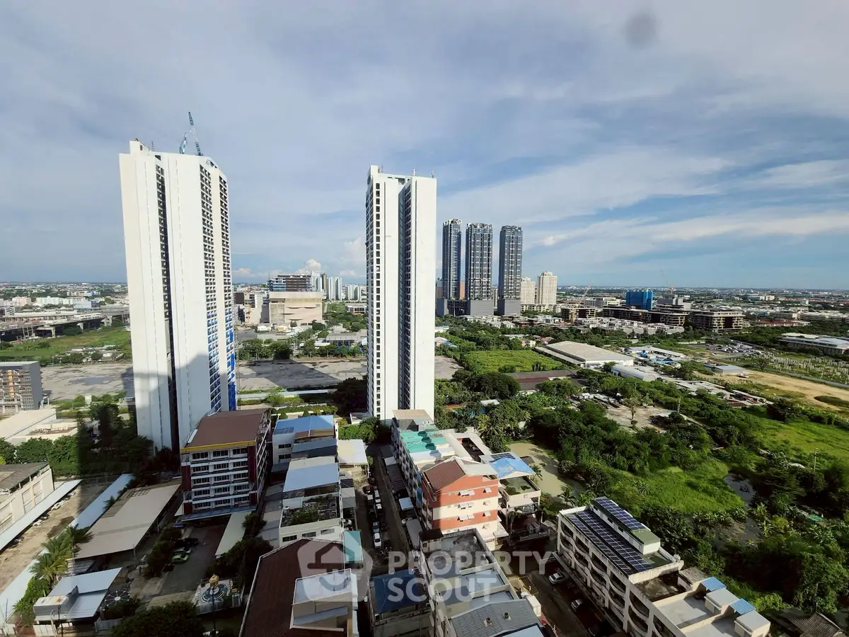 Stunning cityscape view with modern high-rise buildings and lush greenery, perfect for urban living.