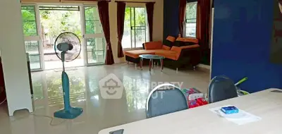 Spacious living room with modern furniture and garden view