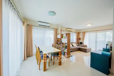 Spacious and bright living room with modern furniture and large windows