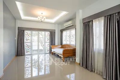 Spacious living room with elegant curtains and natural light