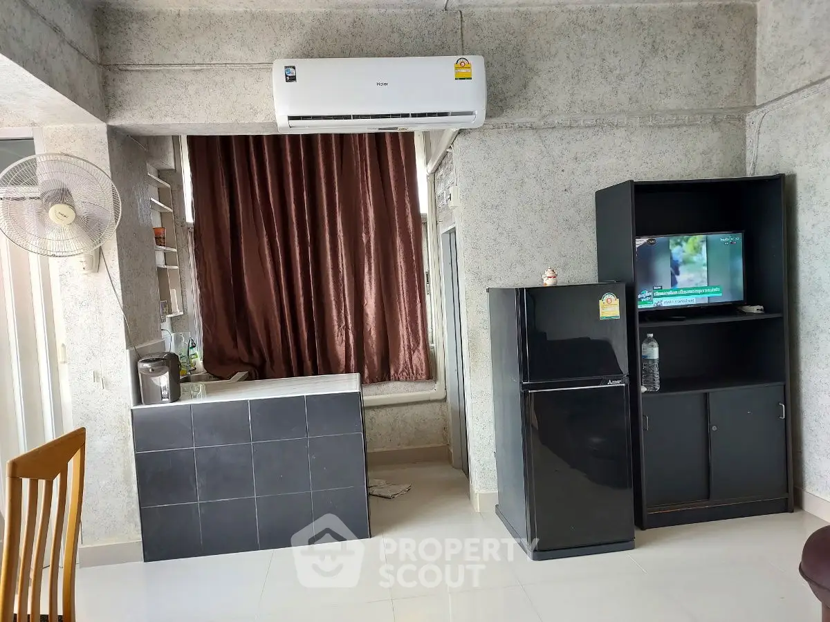 Modern living room with air conditioning and compact entertainment unit
