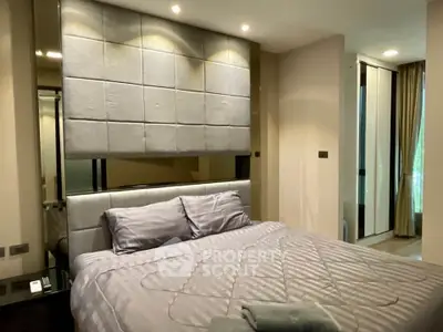 Luxurious bedroom with modern decor and plush bedding in a stylish apartment.