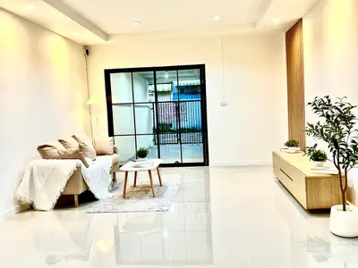 Spacious modern living room with cozy sofa and elegant decor