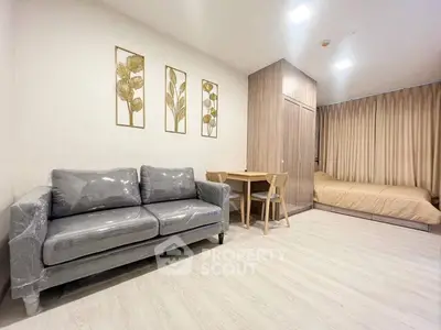 Modern studio apartment with cozy living area and stylish decor