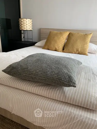 Cozy bedroom with stylish bedding and modern decor