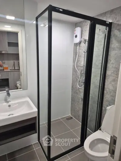 Modern bathroom with sleek shower enclosure and stylish fixtures
