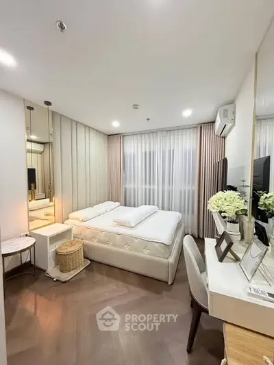 Elegant bedroom with modern decor, featuring a cozy bed, stylish desk, and soft lighting for a serene ambiance.