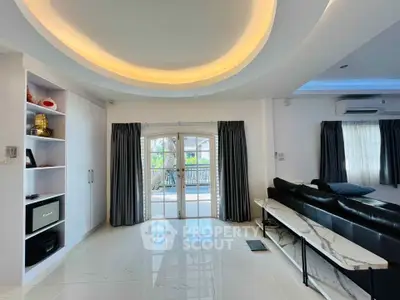 Spacious living room with modern design and elegant lighting