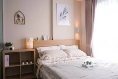 Cozy bedroom with natural light and minimalist decor, perfect for relaxation and comfort.