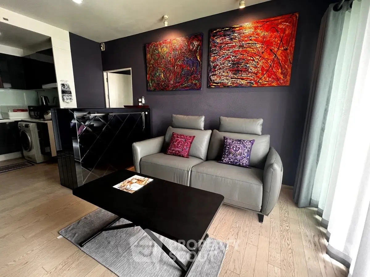 Stylish modern living room with chic decor and open kitchen layout