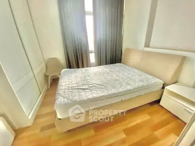 Cozy bedroom with modern furnishings and natural light