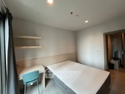 Modern minimalist bedroom with study desk and natural light