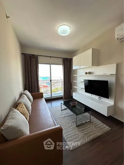 Modern living room with sleek furniture and balcony view