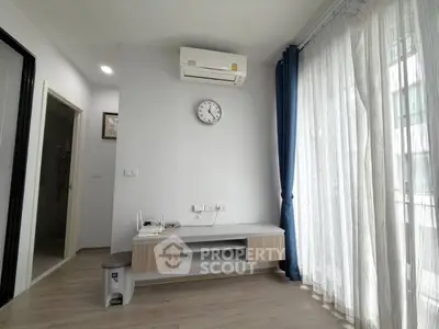 Modern living room with air conditioning and large windows for natural light