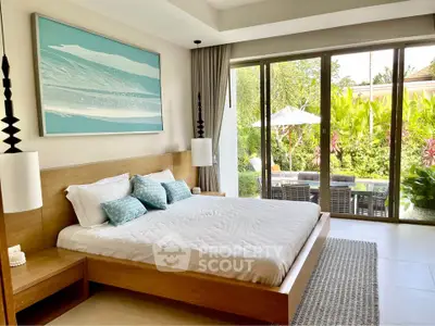 Luxurious bedroom with garden view and modern decor in a serene setting