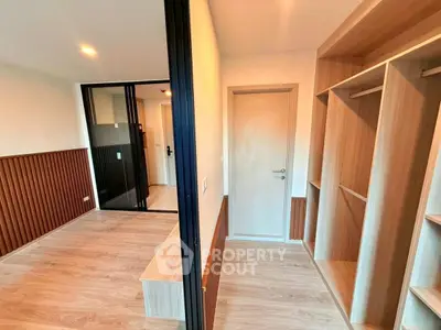 Modern bedroom with walk-in closet and stylish wood paneling