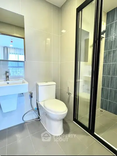 Modern bathroom with sleek design and glass shower enclosure