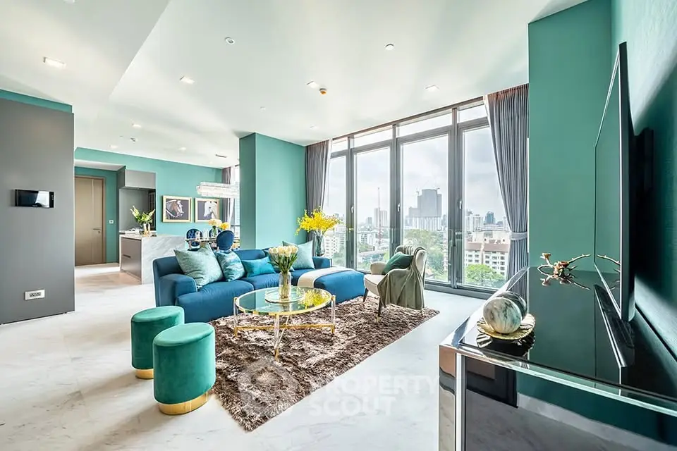 Luxurious modern living room with stunning city view, elegant decor, and open layout in high-rise apartment.
