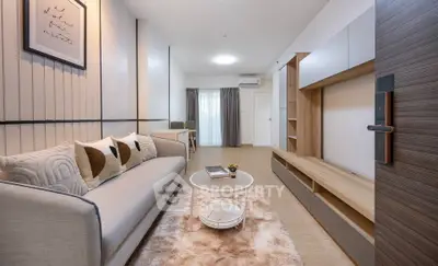Modern living room with stylish decor and cozy seating area, perfect for relaxation and entertainment.