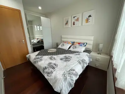 Modern bedroom with stylish decor and large window for natural light