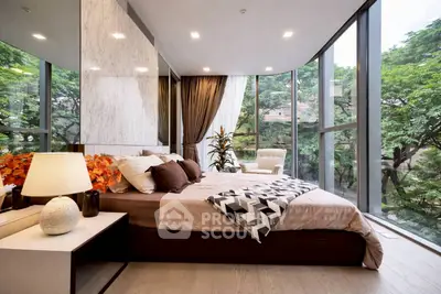 Luxurious bedroom with floor-to-ceiling windows and stunning garden view