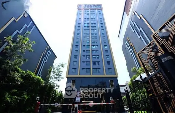 Stunning modern high-rise building with unique architectural design and lush greenery