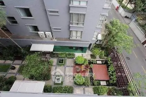 Stunning aerial view of modern building with lush garden courtyard